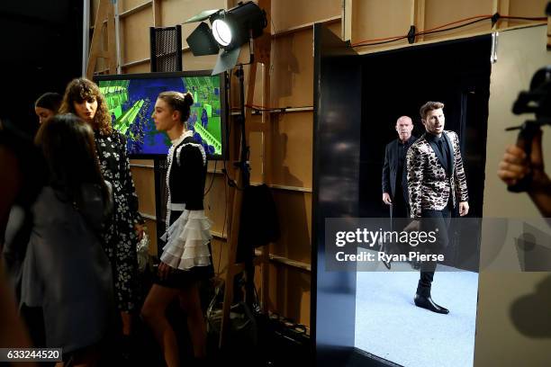 Model Jason Dundas prepares backstage during rehearsal ahead of the David Jones Autumn/Winter 2016 Fashion Launch at St Mary's Cathedral on February...