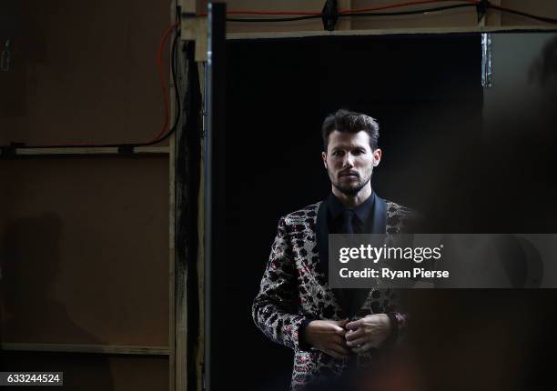 Model Jason Dundas prepares backstage during rehearsal ahead of the David Jones Autumn/Winter 2016 Fashion Launch at St Mary's Cathedral on February...