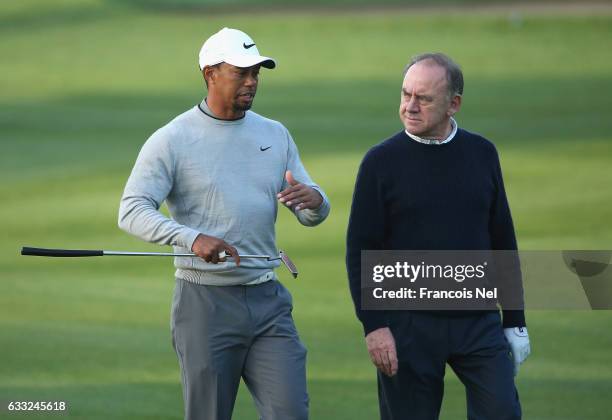 Tiger Woods of the USA speaks to Peter Dawson the President of the International Golf Federation during the pro-am event prior to the Omega Dubai...