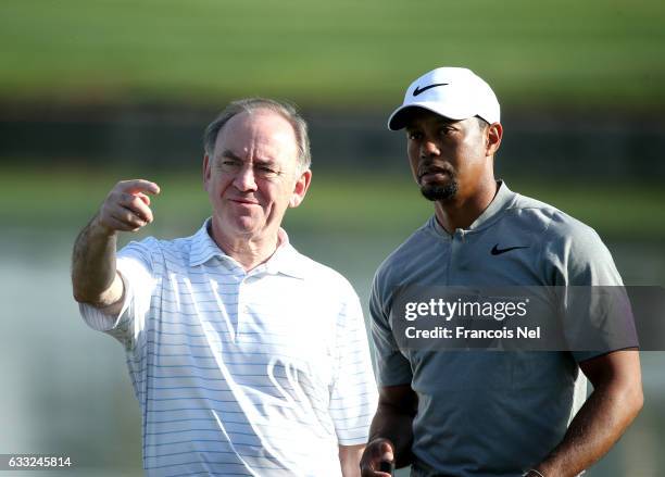 Peter Dawson the President of the International Golf Federation speaks to Tiger Woods of the USA during the pro-am event prior to the Omega Dubai...