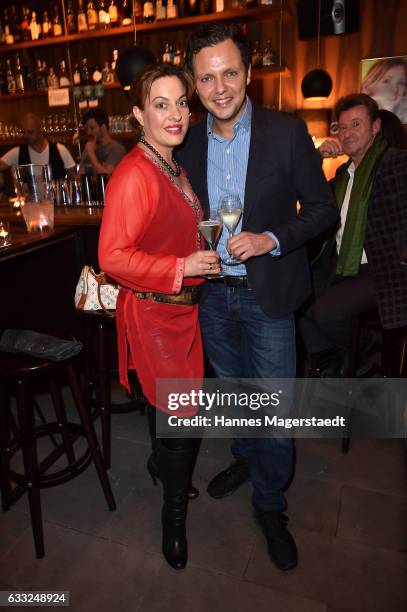 Actress Julia Dahmen and her husband Carlo Fiorito during the 'Goldene Momente' Vernissage at Bruckmann's Bar on January 31, 2017 in Munich, Germany.