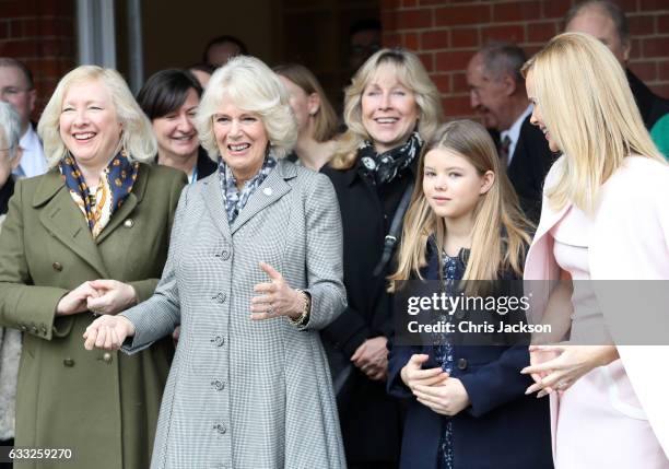 Camilla, Duchess Of Cornwall watches her dog Beth compete an agility course with Amanda Holden and her daughter Alexa Hughes during her visit to...