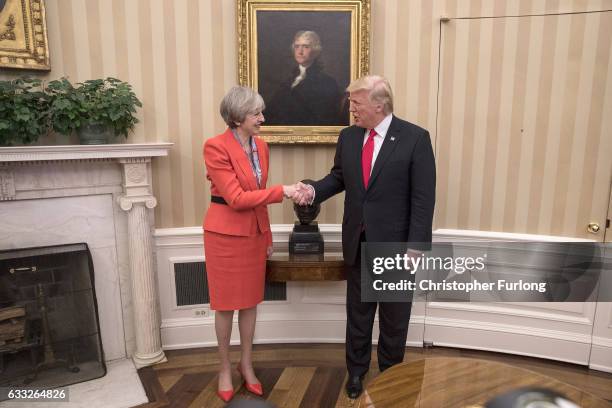 British Prime Minister Theresa May with U.S. President Donald Trump in The Oval Office at The White House on January 27, 2017 in Washington, DC....