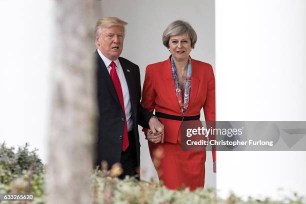 British Prime Minister Theresa May and U.S. President Donald Trump walk along The Colonnade of the West Wing at The White House on January 27, 2017...