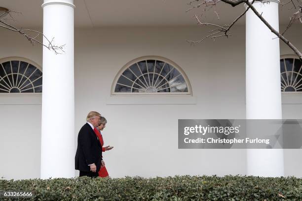 British Prime Minister Theresa May and U.S. President Donald Trump walk along The Colonnade of the West Wing at The White House on January 27, 2017...