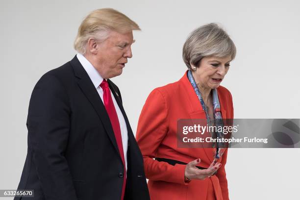 British Prime Minister Theresa May and U.S. President Donald Trump walk along The Colonnade of the West Wing at The White House on January 27, 2017...