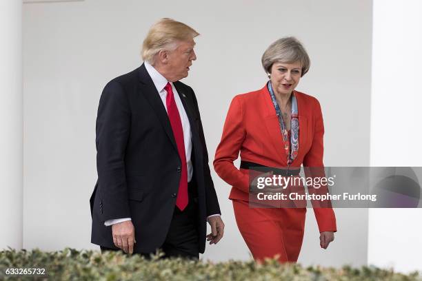 British Prime Minister Theresa May and U.S. President Donald Trump walk along The Colonnade of the West Wing at The White House on January 27, 2017...