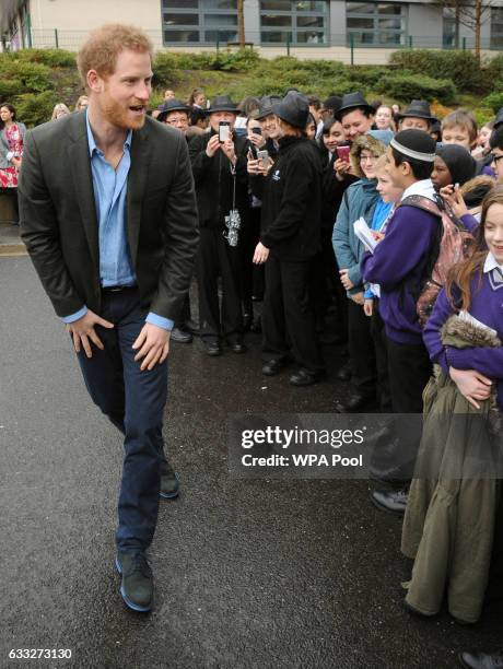 Prince Harry speaks to pupils during a meeting with teachers and tutors during a visit to the Full Effect and Coach Core programmes at Nottingham...