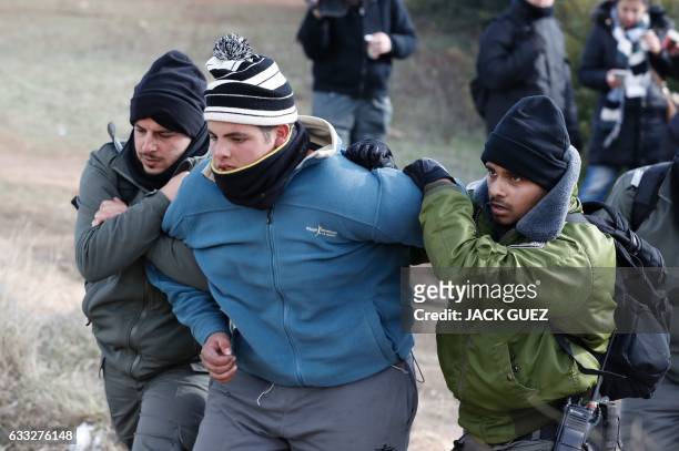 An Israeli settler is evicted by security forces at the Amona outpost, northeast of Ramallah, on February 1, 2017 as they eviction process of the...
