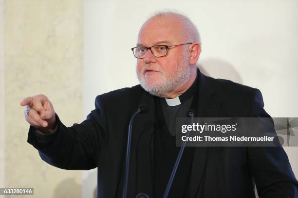 Cardinal Reinhard Marx, Chairman of the German Bishops Conference talks at the Eugen Bolz Award for German Chancellor Angela Merkel in recognition of...