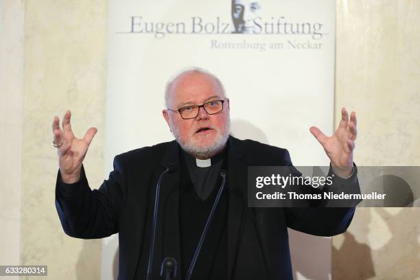 Cardinal Reinhard Marx, Chairman of the German Bishops Conference talks at the Eugen Bolz Award for German Chancellor Angela Merkel in recognition of...