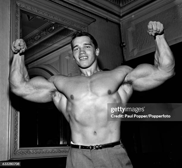 American bodybuilder Arnold Schwarzenegger posing at the Victoria Palace Theatre in London, circa 1968.