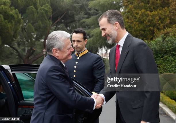 In this handout photo provided by Casa de S.M. El Rey de Espana, King Felipe of Spain welcomes President of Germany Joachim Gauck at the Zarzuela...