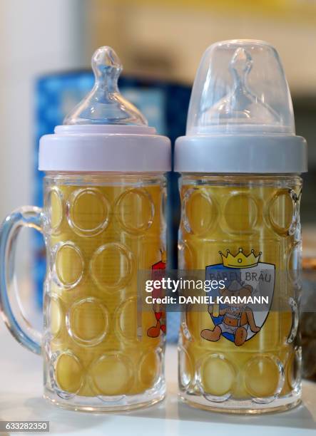 Baby bottles in beer glass design by German company "Paul der Baer" are on display at the International Toy Fair in Nuremberg, southern Germany, on...