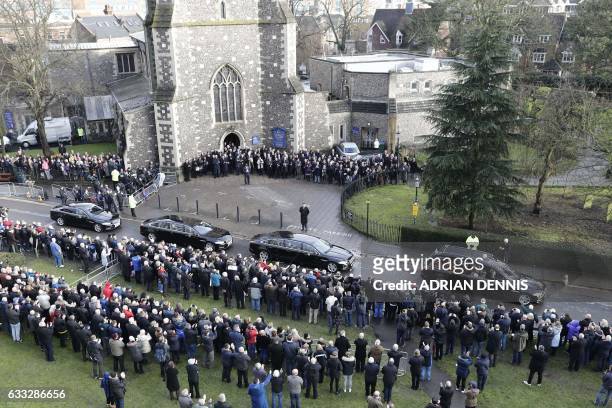 The hearse carrying the coffin of former England manager and manager of Watford football club Graham Taylor leaves church after his funeral service...