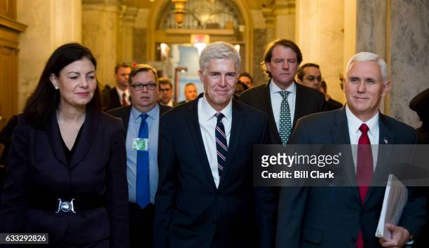 President Donald Trump's nominee for the Supreme Court Judge Neil Gorsuch, center, arrives in the Capitol flanked by former Sen. Kelly Ayotte,...