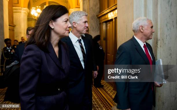 President Donald Trump's nominee for the Supreme Court Judge Neil Gorsuch, center, arrives in the Capitol flanked by former Sen. Kelly Ayotte,...