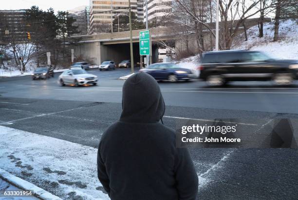 An undocumented immigrant waits in the snow for work along a city street on February 1, 2017 in Stamford, Connecticut. The city of Stamford has an...