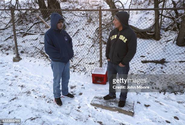 Undocumented immigrants wait for work along a city street on February 1, 2017 in Stamford, Connecticut. The city of Stamford has an official zone for...