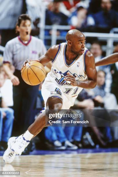 Jacque Vaughn of the Utah Jazz dribbles against the Seattle SuperSonics during a game played on November 14, 1997 at the Delta Center in Salt Lake...