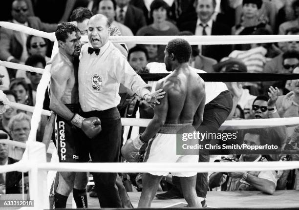 Referee Joe Cortez comes between boxers Azumah Nelson of Ghana and Jeff Fenech of Australia in Las Vegas on 28th June 1991. The bout ended in a draw...