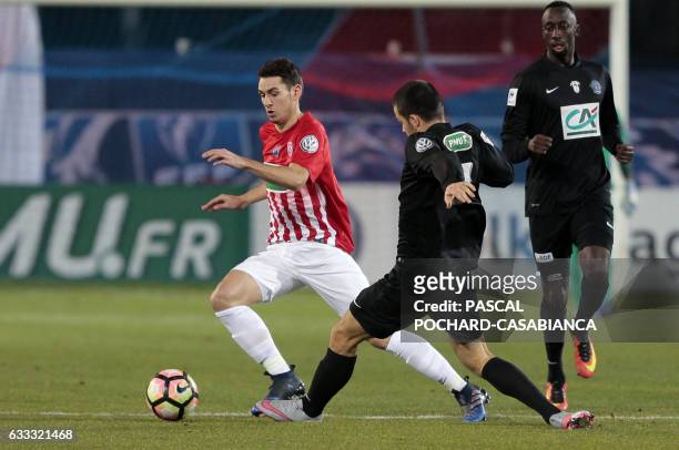 Nancy's French midfielder Vincent Marchetti vies with Bastia's French defender Quentin Lacour during the French Cup football match between CA Bastia...