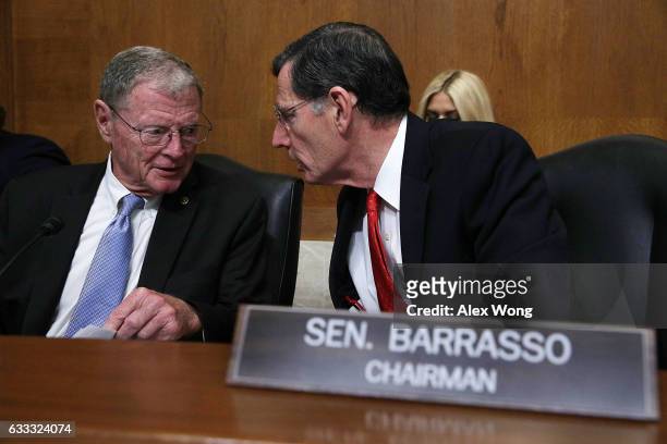 Committee Chairman Sen. John Barrasso of the Senate Environment and Public Works Committee talks to Sen. James Inhofe after a meeting to vote on the...