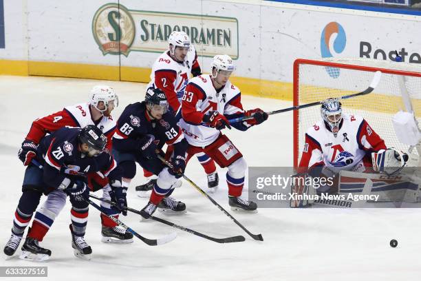 Jan. 31, 2017 -- Pavel Kraskovsky of Lokomotiv Jaroslavl fights for a puck with Michal Hlinka and Jeff Taffe of HC Slovan Bratislava during the...