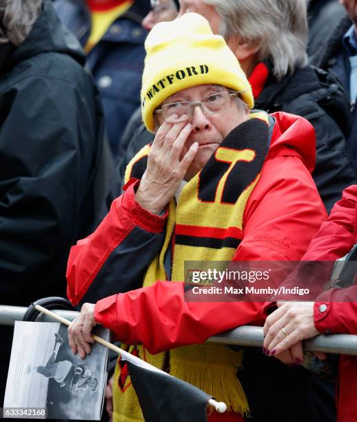 Watford Football Club fan attends the funeral of former England football manager Graham Taylor at St Mary's Church on February 1, 2017 in Watford,...