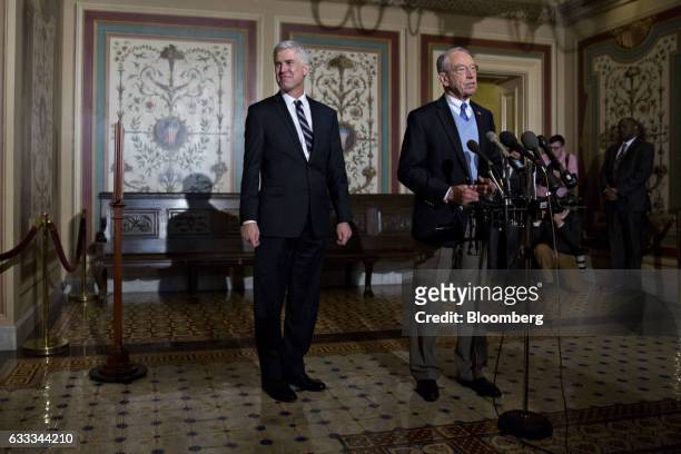 Senator Chuck Grassley, a Republican from Iowa, right, speaks as Neil Gorsuch, Supreme Court nominee for U.S. President Donald Trump, stands during a...