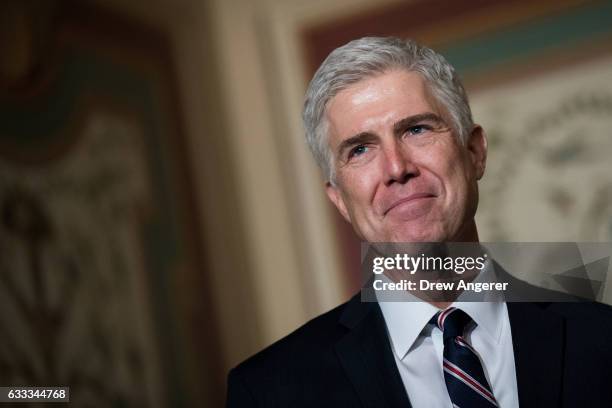 Supreme Court nominee Neil Gorsuch looks on as Senate Judiciary chairman Sen. Chuck Grassley speaks to reporters before their meeting on Capitol...