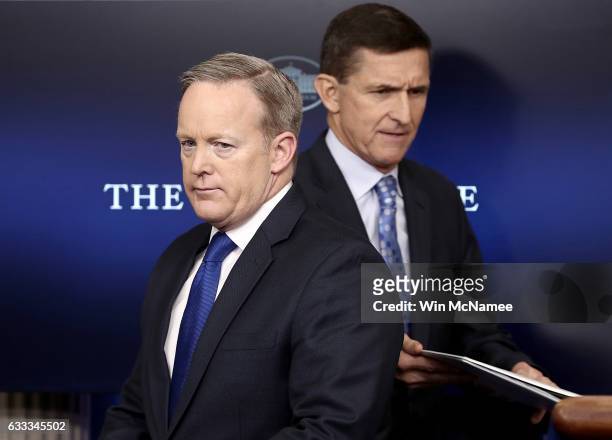 White House Press Secretary Sean Spicer yields the briefing room podium to National Security Adviser Michael Flynn February 1, 2017 in Washington,...