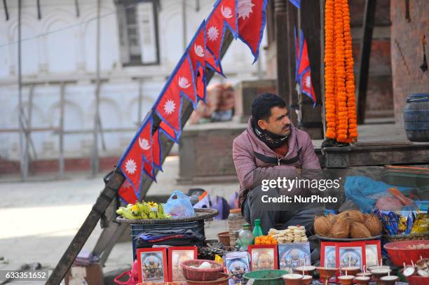 42yrs old selling ritual offering infornt of Kaal Bhairab, Basantapur Durbar Square, Kathmandu, Nepal on Wednesday, February 01, 2017. Thapa used to...