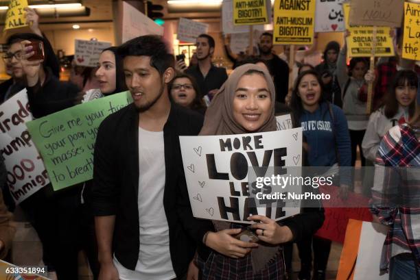 Demonstrators at Los Angeles International Airport protest against President Trump's executive order to ban entry into the US to travelers from seven...