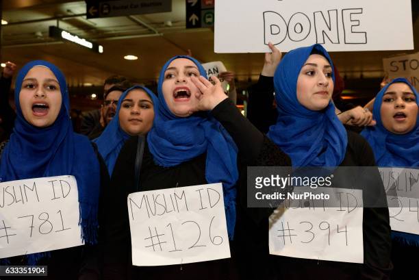 Demonstrators at Los Angeles International Airport protest against President Trump's executive order to ban entry into the US to travelers from seven...