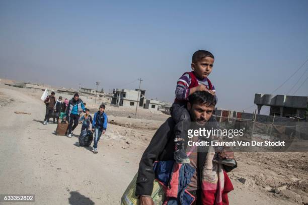 Civilians from the Gogjali, Saddam and Samah districts of Mosul flee their homes as members of Iraqi Special Operations Forces enter Mosul to retake...