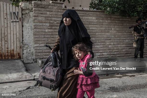 Civilians in Mosul flee their homes as members of Iraqi Special Operations Forces enter Mosul to retake the city from the Islamic State. The...