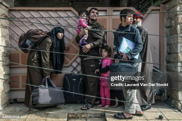 Civilians in Mosul flee their homes as members of Iraqi Special Operations Forces enter Mosul to retake the city from the Islamic State. The...