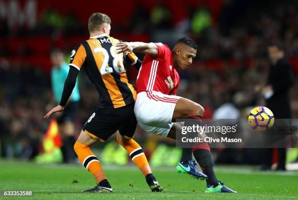 Antonio Valencia of Manchester United is challenged by Josh Tymon of Hull City during the Premier League match between Manchester United and Hull...