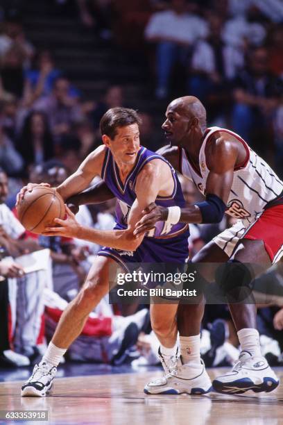 Jeff Hornacek of the Utah Jazz drives against Clyde Drexler of the Houston Rockets during Game Three of the Western Conference Finals on May 23, 1997...