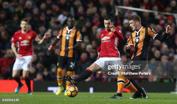 Henrikh Mkhitaryan of Manchester United in action with Josh Tymon of Hull City during the Premier League match between Manchester United and Hull...