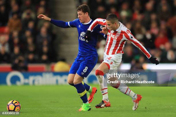 Ibrahim Afellay of Stoke City closes down Ross Barkley of Everton during the Premier League match between Stoke City and Everton at Bet365 Stadium on...