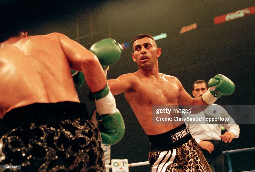 Boxer Prince Naseem Hamed of Great Britain in action, watched by