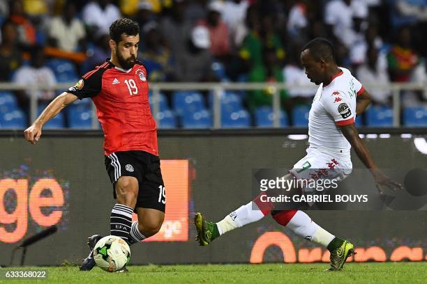 Egypt's forward Abdallah Said challenges Burkina Faso's midfielder Abdou Razack Traore during the 2017 Africa Cup of Nations semi-final football...