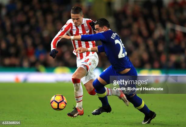 Ramiro Funes Mori of Everton chases Ibrahim Afellay of Stoke City during the Premier League match between Stoke City and Everton at Bet365 Stadium on...