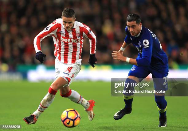 Ramiro Funes Mori of Everton chases Ibrahim Afellay of Stoke City during the Premier League match between Stoke City and Everton at Bet365 Stadium on...