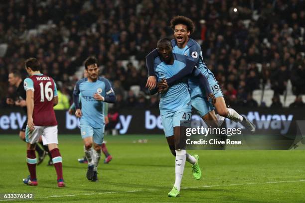 Yaya Toure of Manchester City celebrates scoring his team's fourth goal with Leroy Sane during the Premier League match between West Ham United and...
