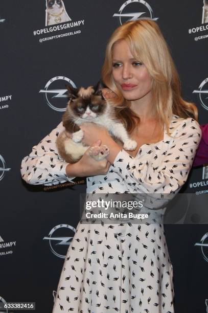 Georgia May Jagger with Grumpy Cat attends the 'Presentation of The New Opel Calender 2017' at Kraftwerk Mitte on February 1, 2017 in Berlin, Germany.