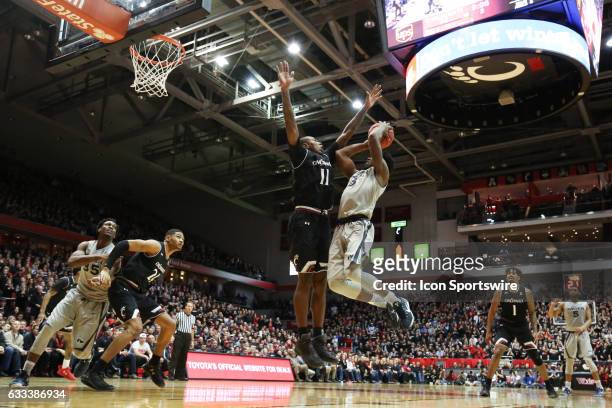 Xavier Musketeers guard Quentin Goodin drives to the basket with Cincinnati Bearcats forward Gary Clark defending during the game against the Xavier...