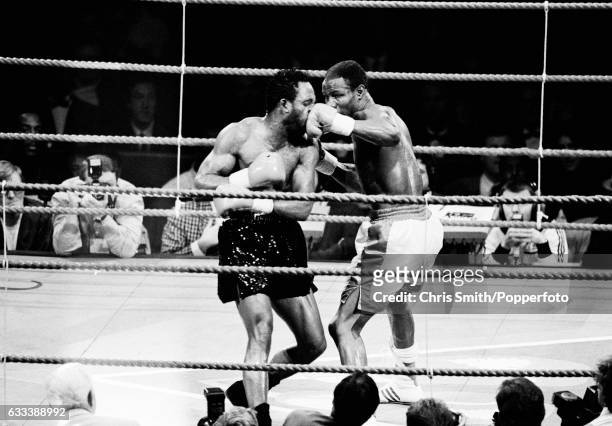 Boxers Nigel Benn and Chris Eubank of Great Britain in action during their WBO Middleweight championship bout in Birmingham on 18th November 1990....